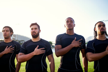 Keeping up with traditions. Cropped shot of a diverse group of sportsmen standing together and singing their national anthem before playing rugby. - obrazy, fototapety, plakaty