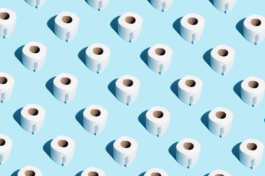 Rolls of soft toilet paper on blue. Isometric.  High unexpected demand. Seamless pattern. Funny concept.