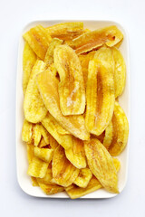 Banana slice chips on white background