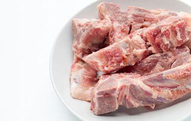 Raw pork bone on white background.