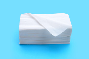 Facial tissue on blue background.