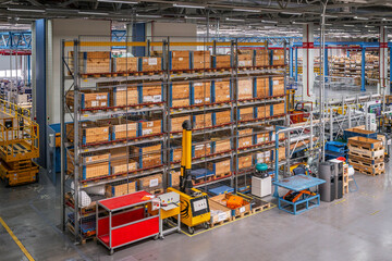 Boxes on high shelves in a spacious warehouse