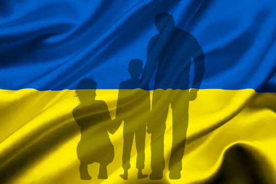 Shadow Of A Ukrainian Family Fleeing The Ukrainian Flag, Russia - Ukraine Conflict