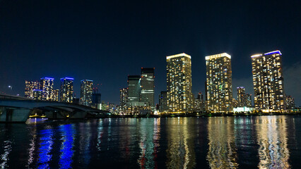 Fototapeta na wymiar Night view of a high-rise condominium along an urban river_44