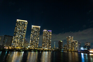 Fototapeta premium Night view of a high-rise condominium along an urban river_48