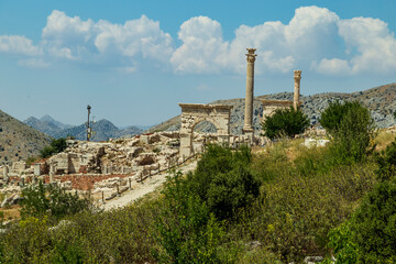 Fototapeta na wymiar Columns and arches of ancient Roman agora at Sagalassos, Burdur Turkey. The Archaeological Site of Sagalassos