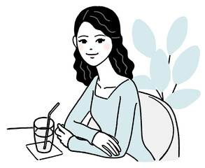 カフェで休憩する若い女性