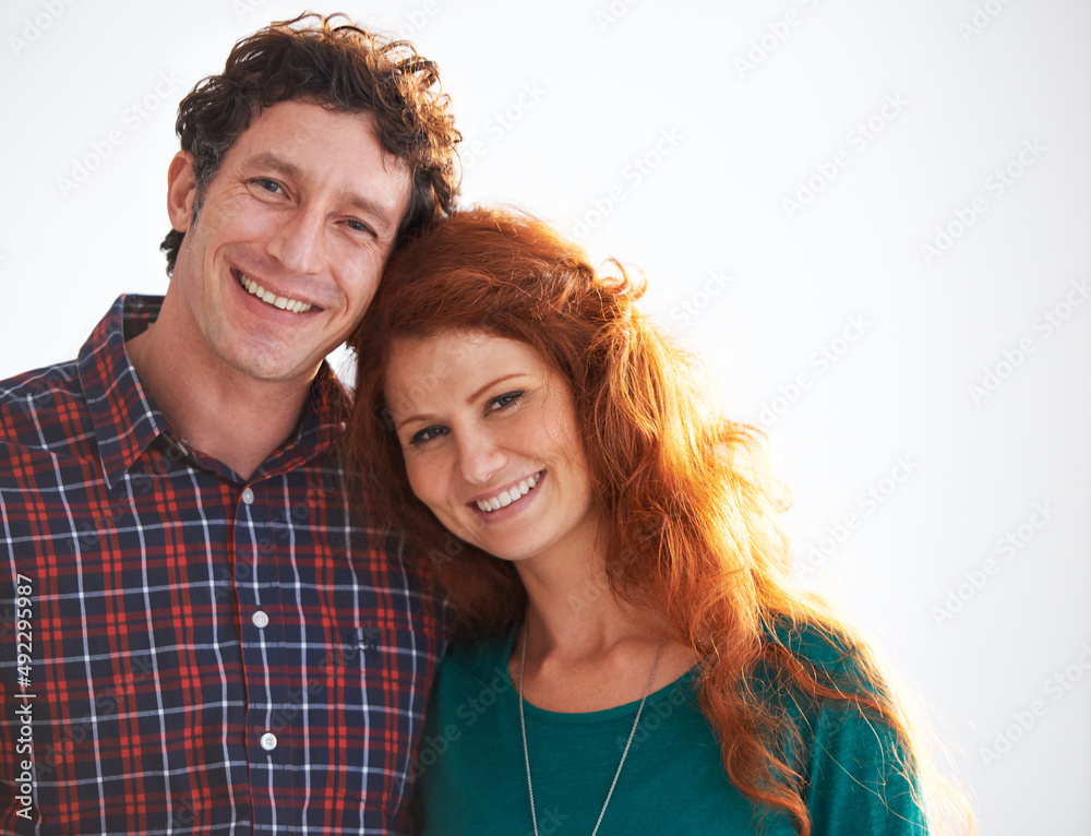 Canvas Prints Their love is radiant. Portrait of a happy and loving young couple standing indoors.