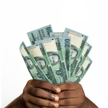 Black hands holding 3D rendered 200 Mozambican metical notes. closeup of Hands holding Mozambican currency notes