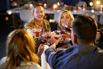 We like to begin our night with a shot. Cropped shot of a group of friends having fun at a nightclub.