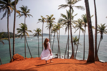 Woman in a white dress on a paradise island