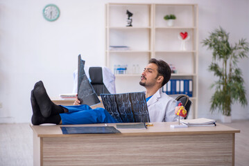 Young male doctor radiologist working in the clinic