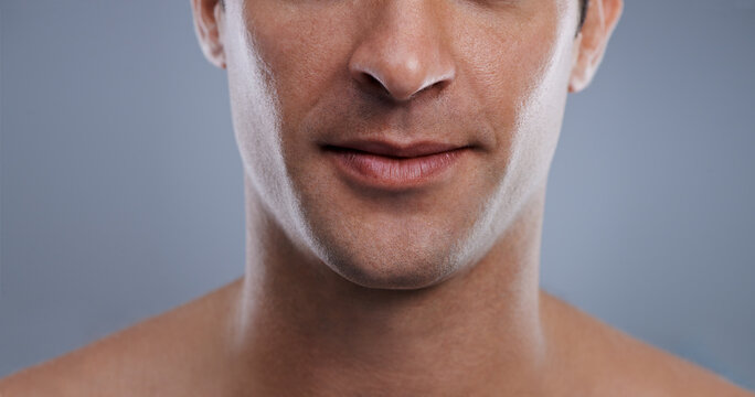 Those are lips any girl would want to kiss. Cropped image of a handsome mans mouth smiling.