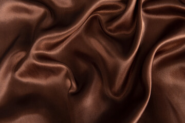 Smooth elegant brown silk or satin texture can use as abstract background.