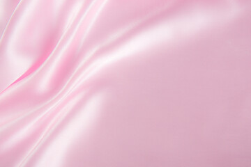 Smooth elegant pink silk or satin texture can use as abstract background.
