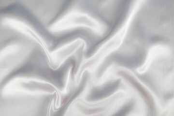 Obraz premium Abstract gray silk fabric texture background. Cloth soft wave. Creases of satin