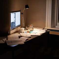 Ready for studies. Cropped shot of a pc and textbooks on a desk in a study.