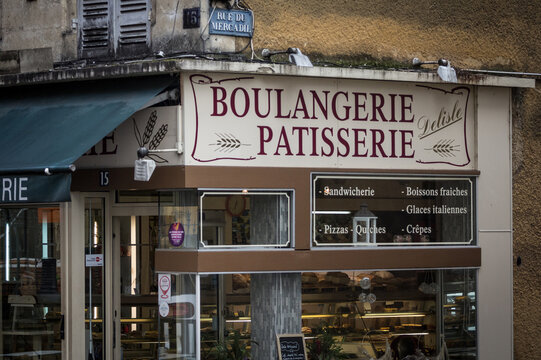 BERGERAC, FRANCE - FEBRUARY 21, 2022: Front store of a Boulangerie Patisserie, a typical french bakery and pastry shop selling bread and pastries, a symbol of french gastronomy and food...