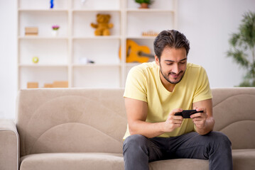 Young man sitting at home during pandemic