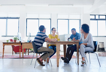 They bring ideas into reality. Shot of a group of designers at work in an office.