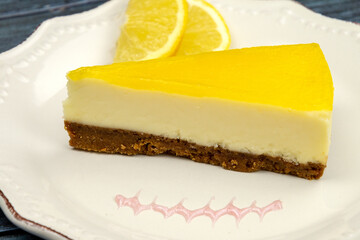 lemon cheesecake in a plate on a gray background