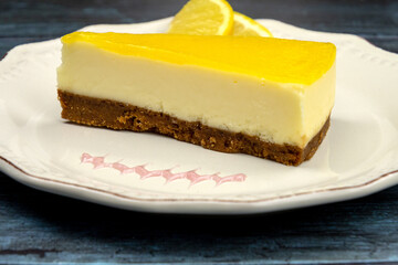 lemon cheesecake in a plate on a gray background