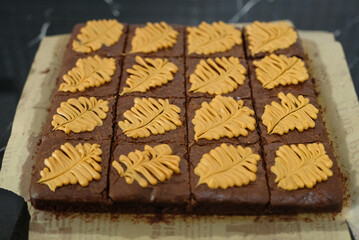 Homemade pieces of brownies on black table