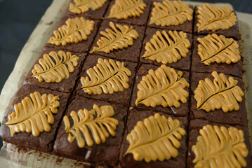 Homemade pieces of brownies on black table