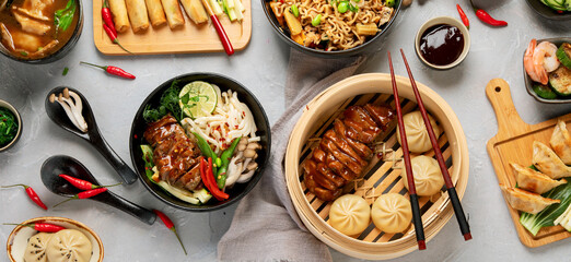 Assorted Chinese food set on light background.