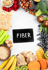 Foods high in fiber on gray background.