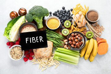 Foods high in fiber on gray background. - obrazy, fototapety, plakaty
