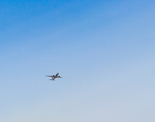 Shot of an airplane on blue sky background. Aviation
