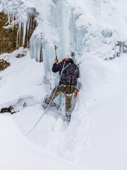 Rescuers climbers in training in the mountains in winter.