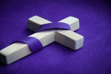 Religious cross on purple background. Good Friday concept