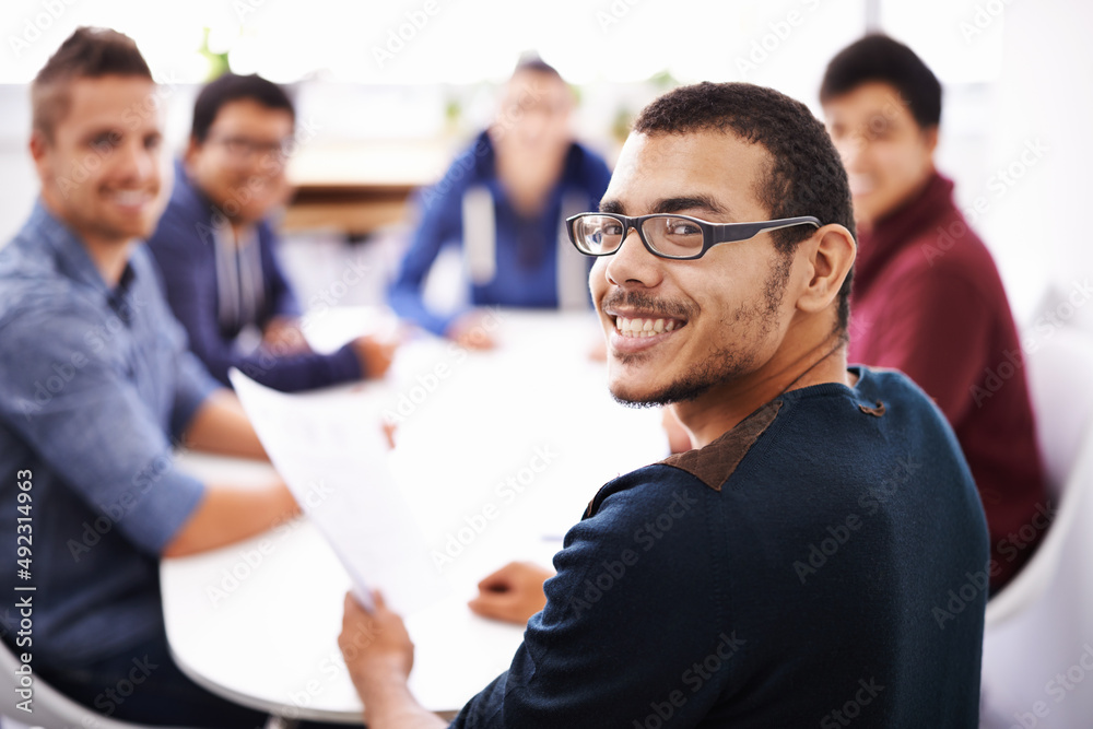Poster his progress report has everyone smiling. shot of a group of guys having a meeting.