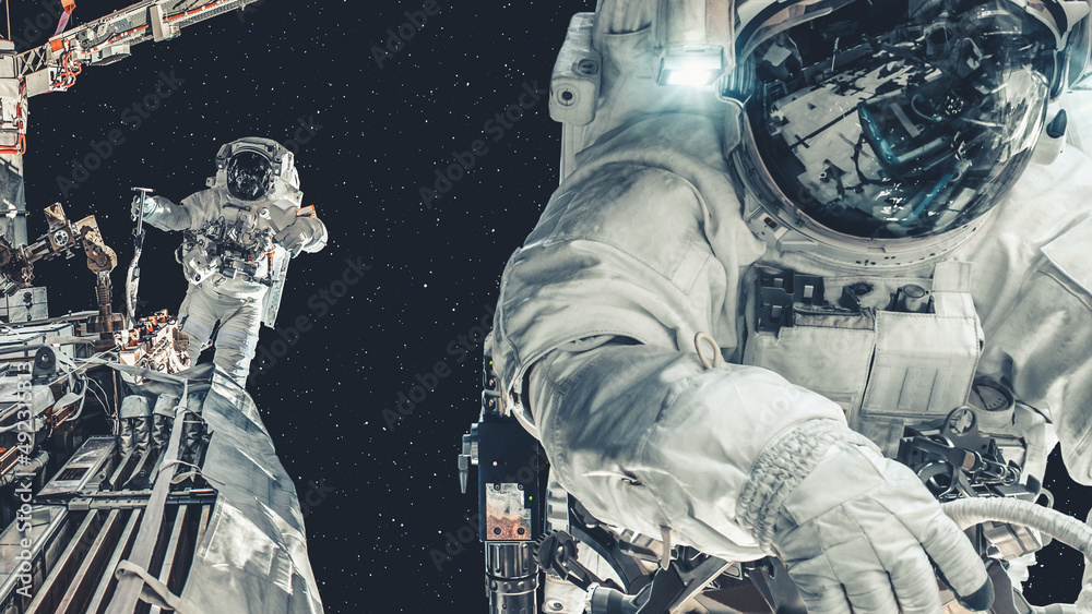 Wall mural astronaut spaceman do spacewalk while working for spaceflight mission at space station . astronaut w
