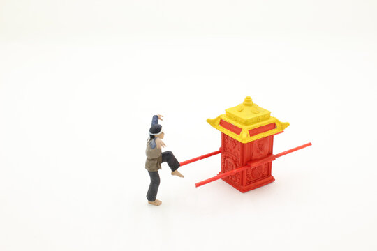 A Mini Figure With Kung Fu Stand With Chinese Sedan Chair