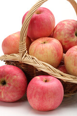 Apples in a basket on a white background.