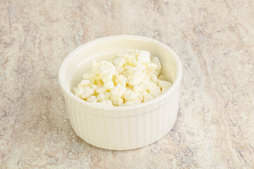 Grained cottage cheese in the bowl