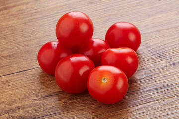 Ripe juicy cherry tomatoes heap