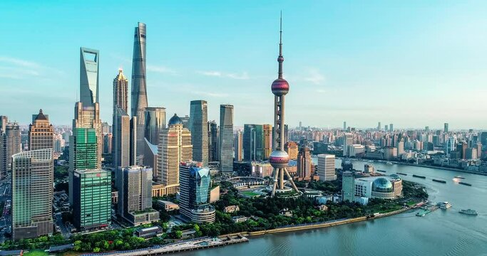Aerial footage of modern commercial office buildings and skyline in Shanghai at dusk, China.