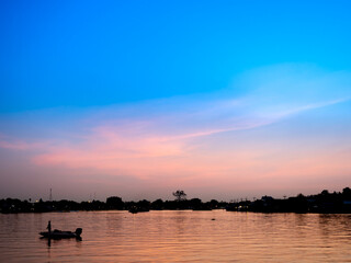 Silhouette The Man Fishig in The Boat
