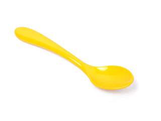 Single yellow plastic spoon
