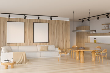 Kitchen interior with sofa and cooking space and dining table. Mock up frames