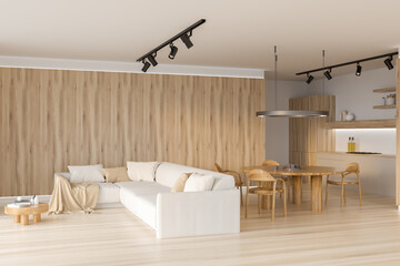 Corner view on bright kitchen room interior with sofa, table