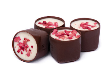 Heap of chocolate glazed sweets with fruit pieces