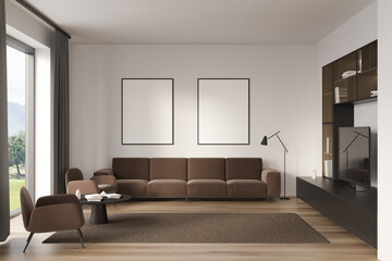 Front view on bright living room interior with two posters