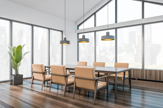 Business meeting room interior with table and seats, window with city view