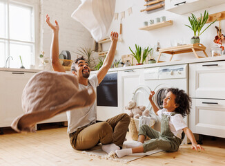 Excited father and kid playing with towels