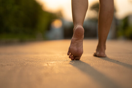 barefoot walking on the floor with beautiful sunset light